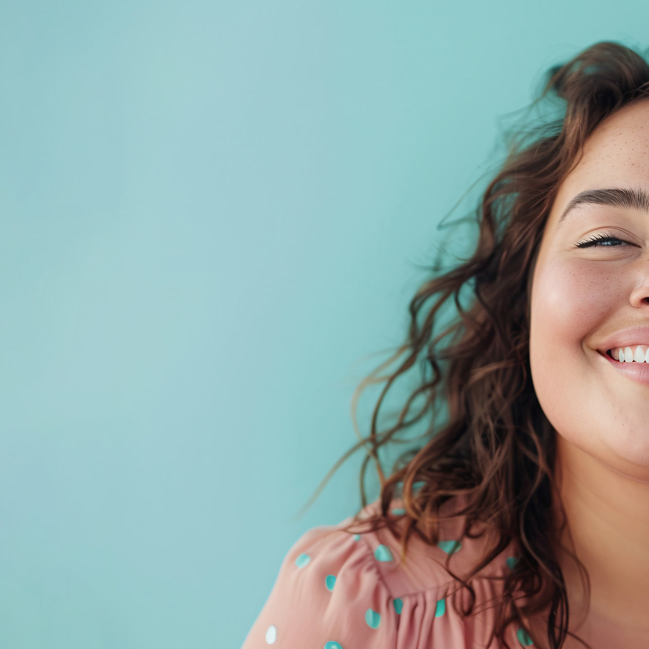 A smiling woman relaxed and ready for a telehealth conversation